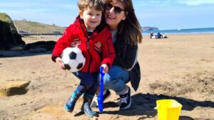 Toddler Playing On The Beach