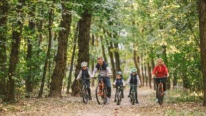 Family Cycling in Forest.