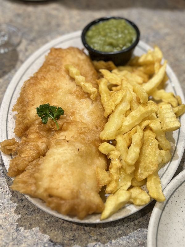 A large plate of Whitby fish and chips.