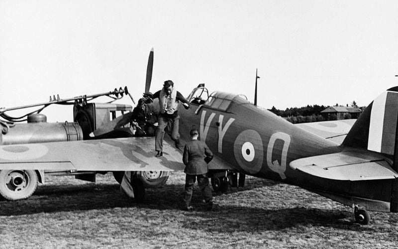 Squadron Leader Townsend of No. 85 Squadron RAF exits his Hawker Hurricane at RAF Castle Camps, July 1940.