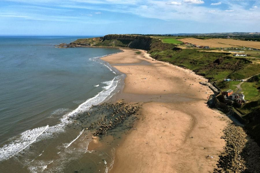 Cayton Bay. Cayton Bay is a surfers paradise and is popular with campervans on Yorkshire Coast road trips.