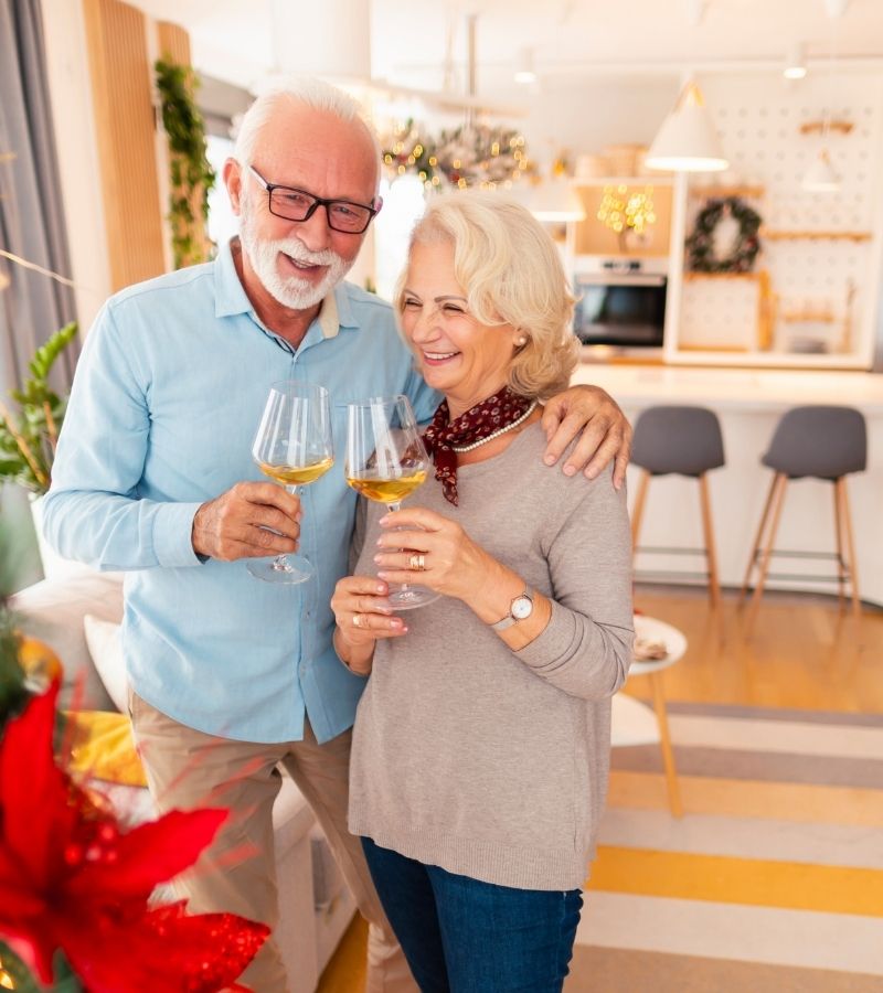 Couple enjoying wine Couple enjoying a glass of wine in their holiday home.